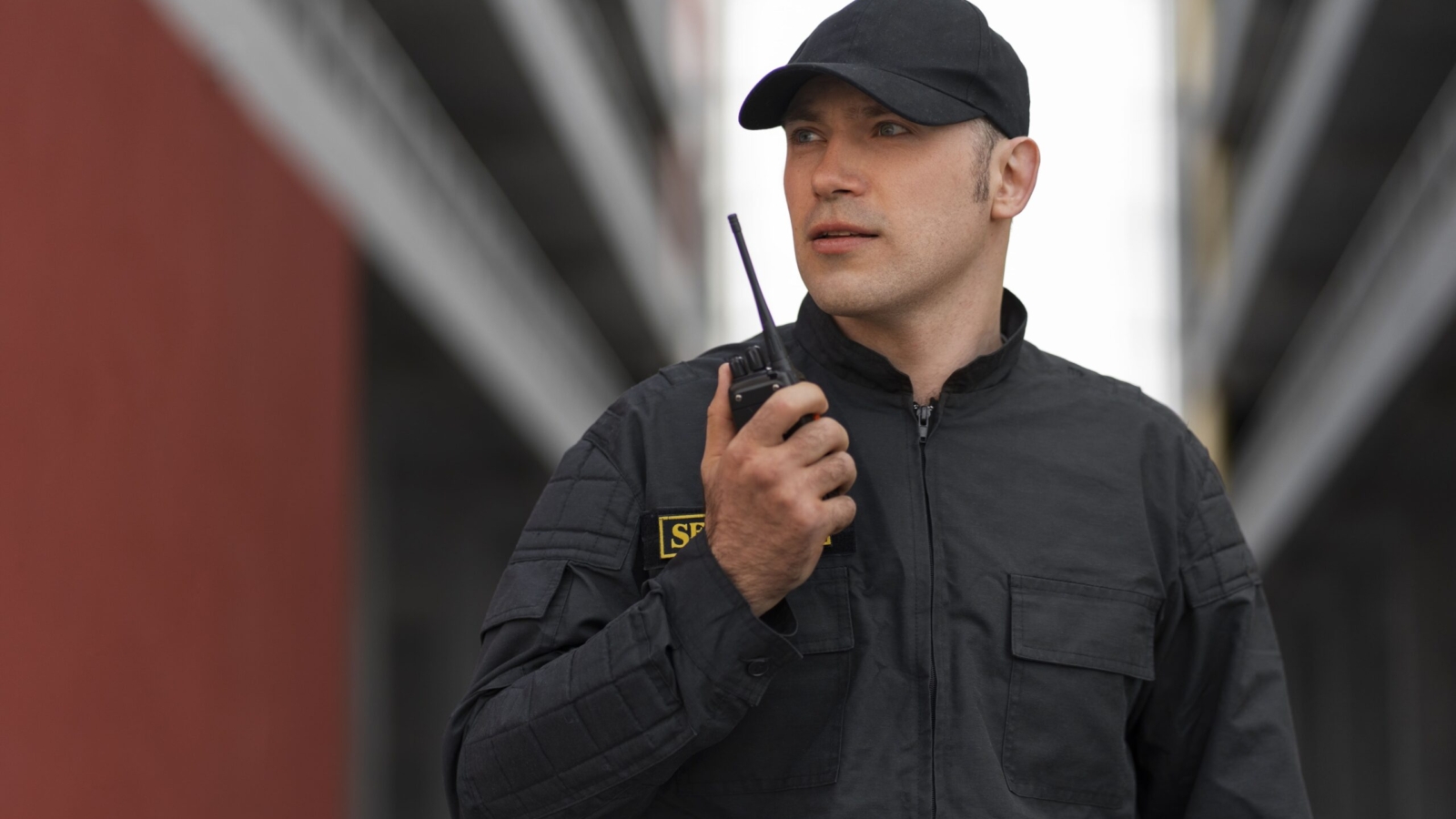 portrait male security guard with radio station min